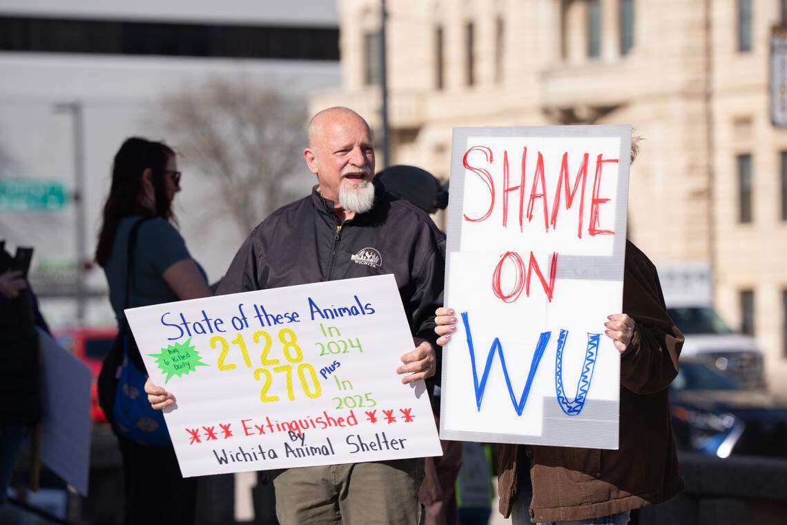 Members of the Sunflower State Animal Guardians held signs at the entrance he former downtown Wichita library where Wichita Mayor Lily Wu gave the State of the City address on Sunday evening.