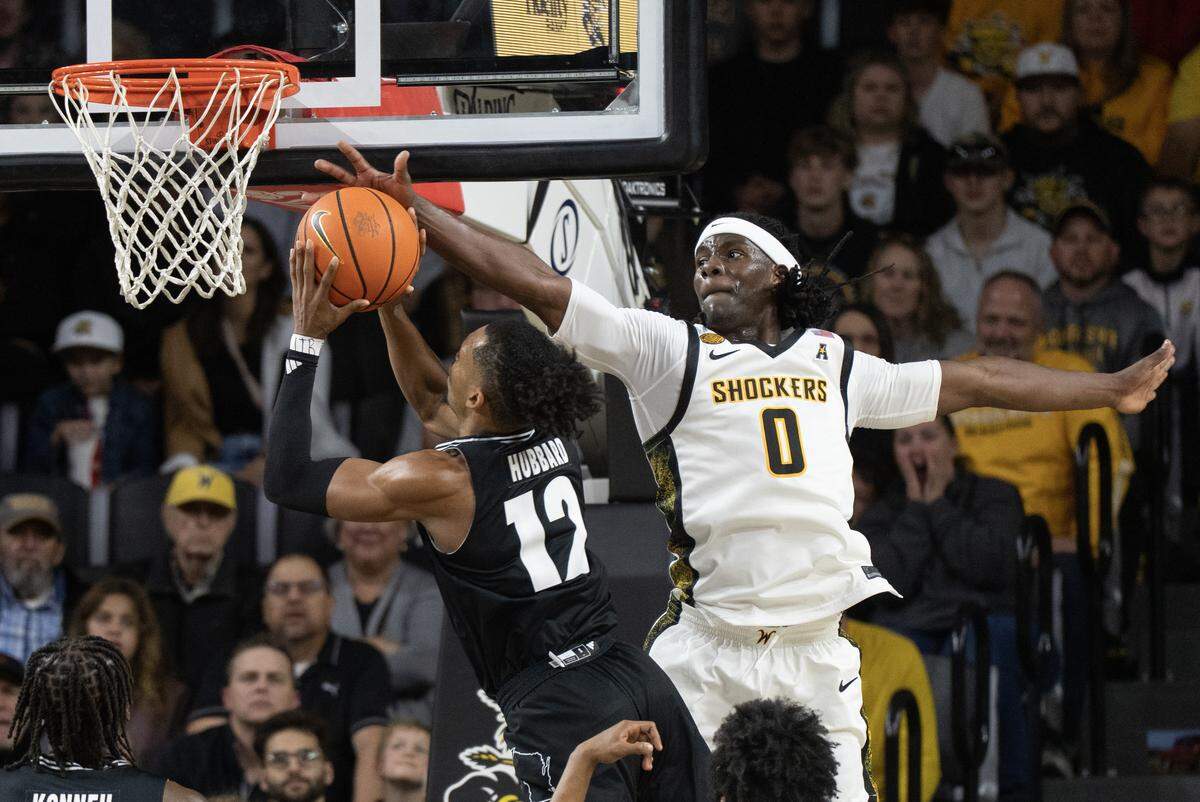 Wichita State’s Karon Boyd blocks the shot of Milwaukee’s Seth Hubbard in the first half at Koch Arena.