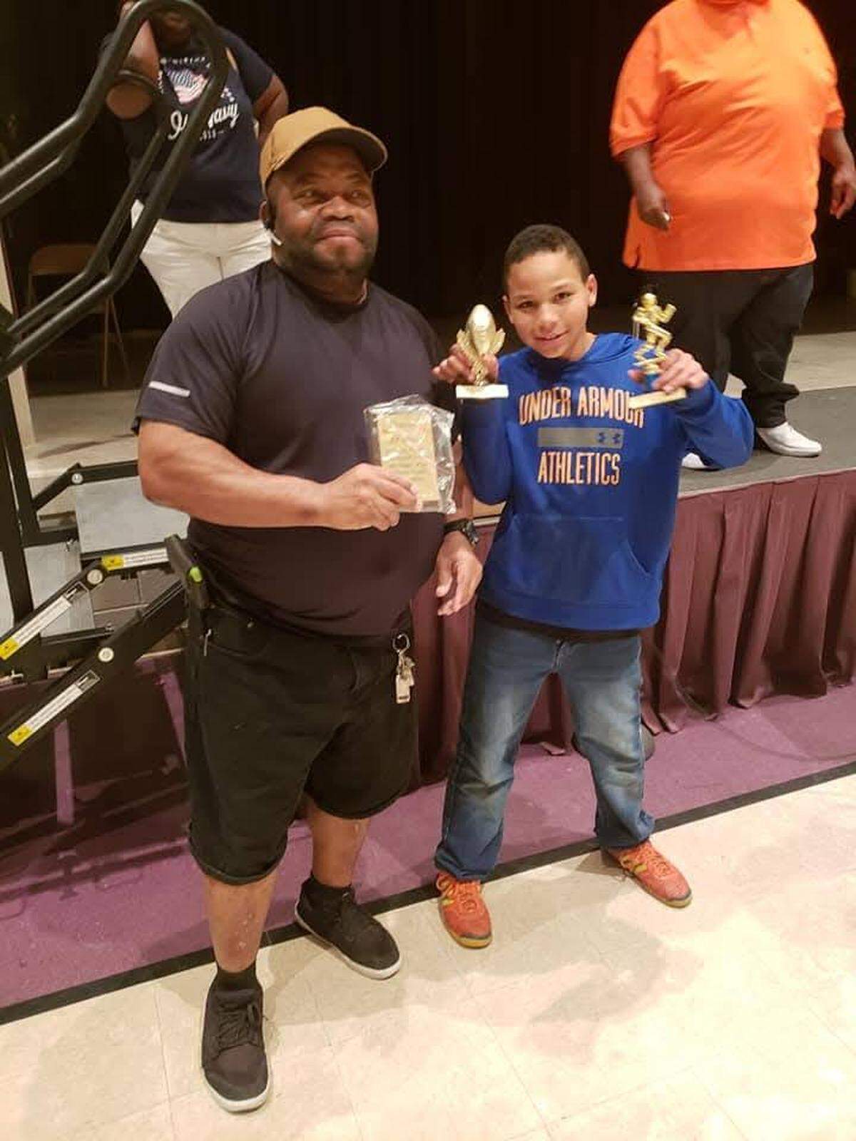 Wichita native Joe Brown (left) was beloved in the youth sports community, as a long-time football coach for the Wichita Trojans who was known to pay for trophies out of pocket to help celebrate his players. Brown, 66, died on Monday.