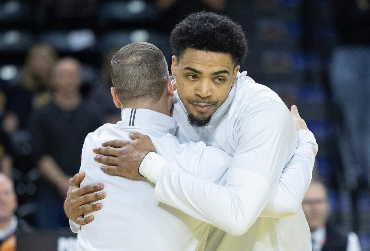 Senior Ronnie DeGray III hugs coach Paul Mills during Wichita State’s senior day ceremonies at Koch Arena on Sunday. 