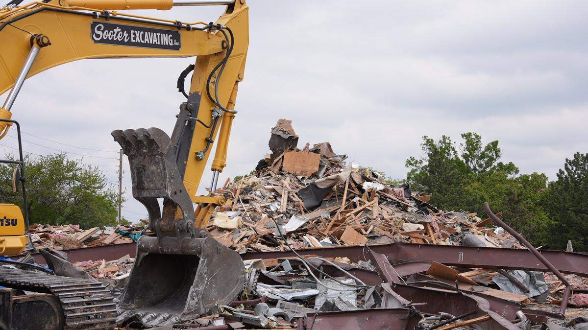 The longtime building where Hen Feathers and a few other businesses used to be was demolished this week. A 7 Brew Coffee is taking its place.