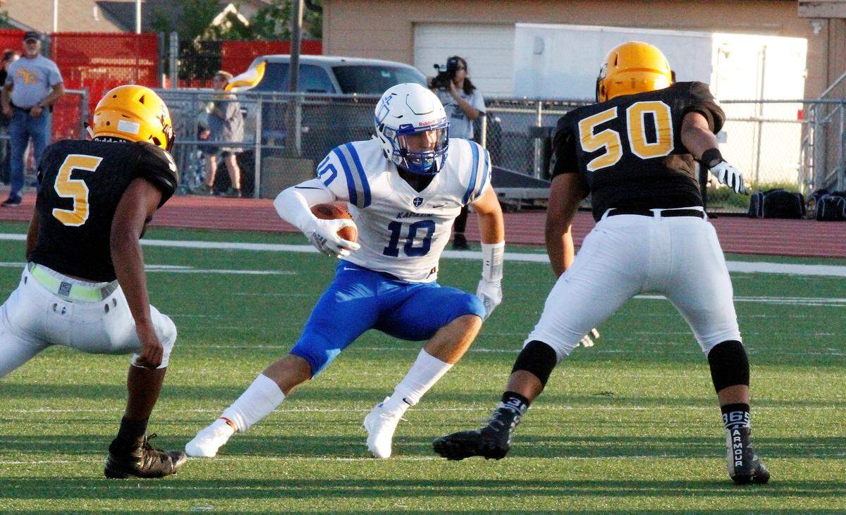 Kapaun senior defensive back Scott Valentas shifts past a defender in the Crusaders’ 26-3 victory over Wichita Southeast on Thursday in the season-opener. (Aug. 30, 2018)