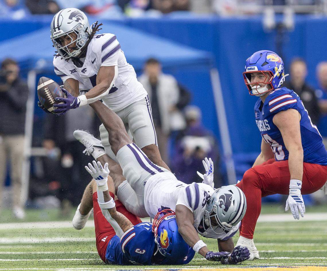 Kansas State’s Daniel Cobbs grabs an interception during the third quarter of their game against Kansas at David Booth Kansas Memorial Stadium on Saturday.