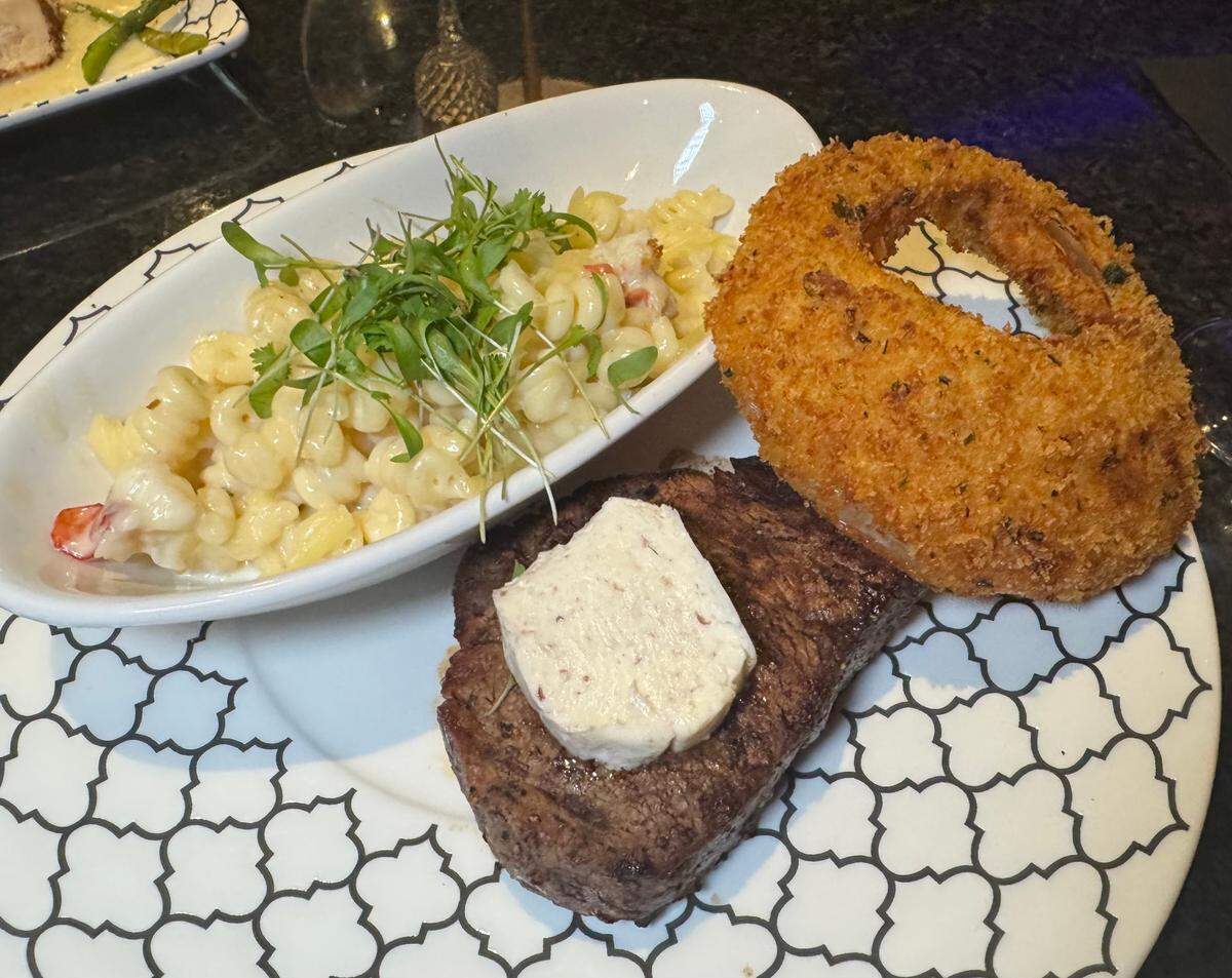 KVH’s 8-ounce filet mignon comes with choice of side and a giant onion ring. Pictured is the lobster mac and cheese.