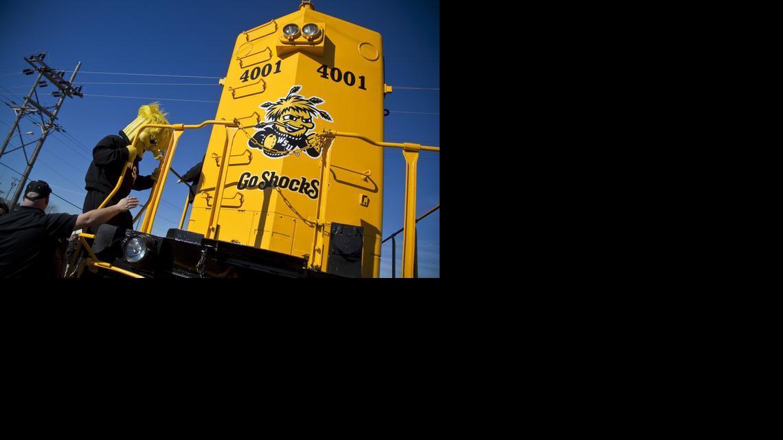 WuShock climbs aboard a 262,000-pound locomotive named Wooo Shock after its rollout by Kansas and Oklahoma Railroad Tuesday morning near downtown Wichita. (March 11, 2014)
