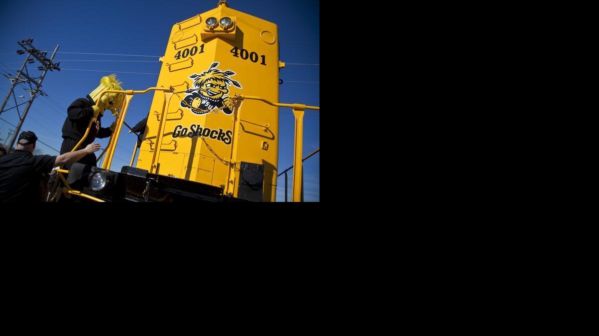 WuShock climbs aboard a 262,000-pound locomotive named Wooo Shock after its rollout by Kansas and Oklahoma Railroad Tuesday morning near downtown Wichita. (March 11, 2014)
