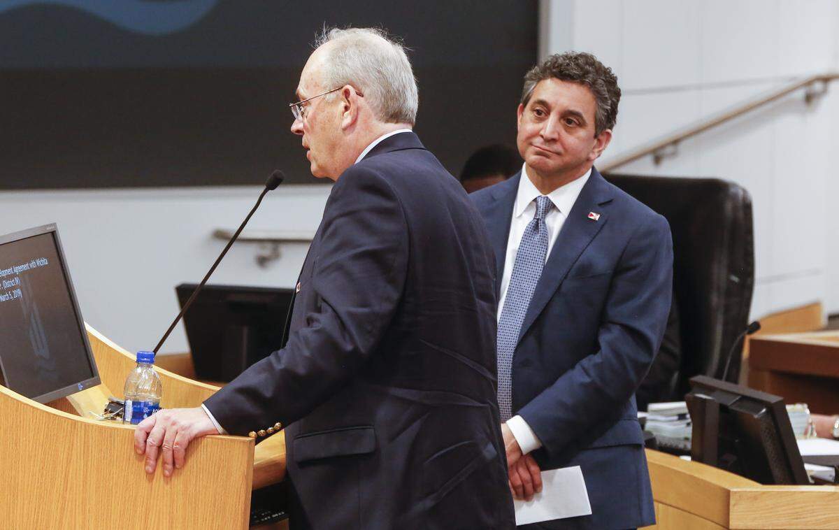 Lou Schwechheimer, owner of the New Orleans Baby Cakes, and local developer George Laham, answer questions before the Wichita City Council on Tuesday night.