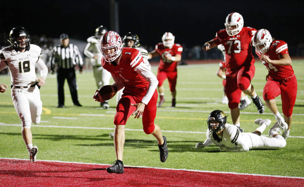 Maize quarter back #1 Caleb Grill scrambles into the end zone for a touchdown Friday night against Maize South.. (November 2, 2018)