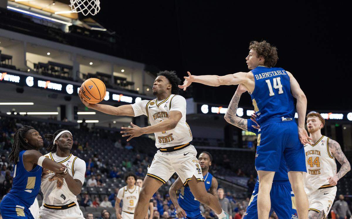 Wichita State Kenyon Giles drives to the basket during the second half of their AAC tournament semifinal game against Tulsa on Saturday in Birmingham.