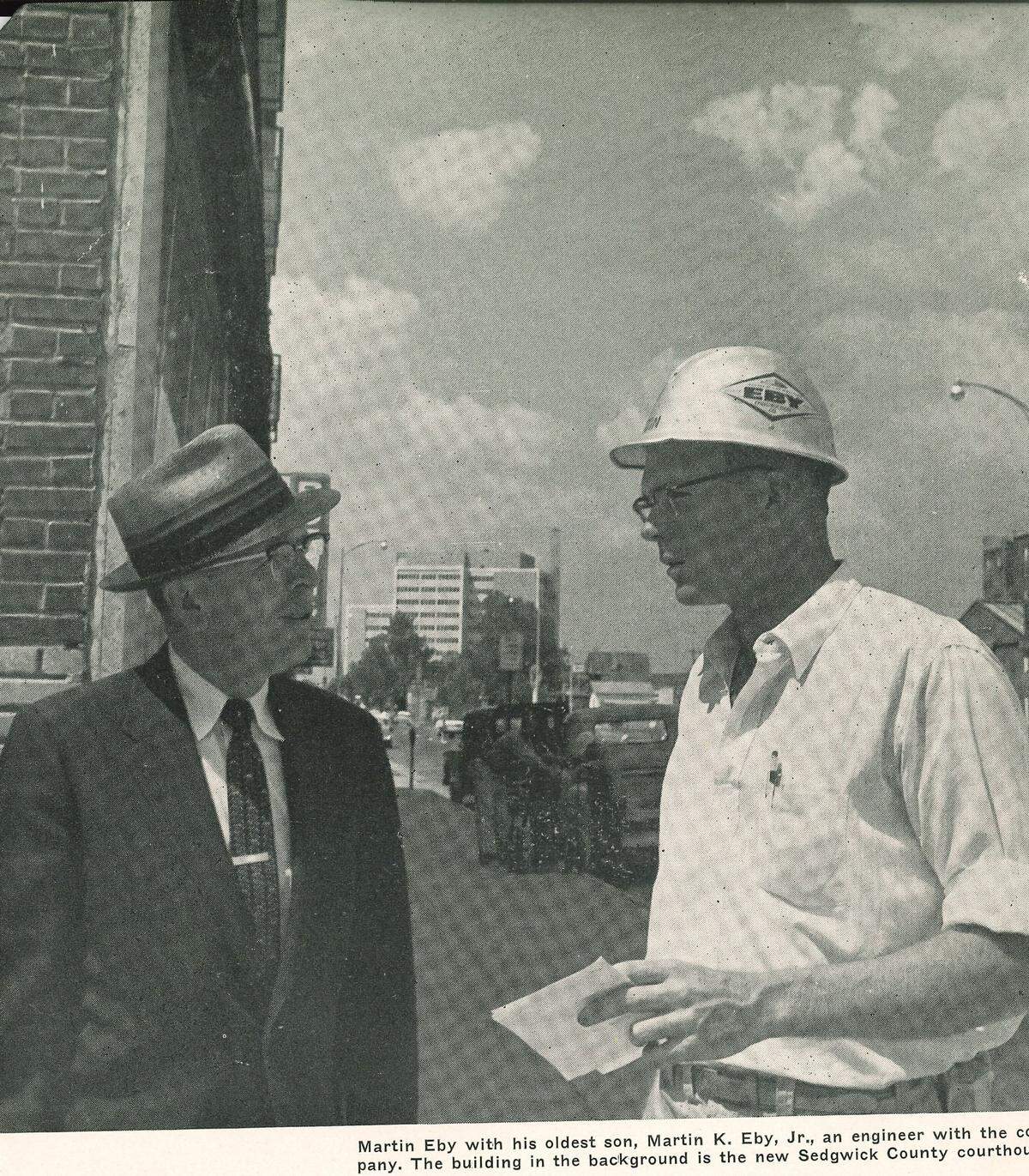 Martin Eby Sr., left, with his son, Martin Eby Jr., with the Sedgwick County Courthouse they built in the background.