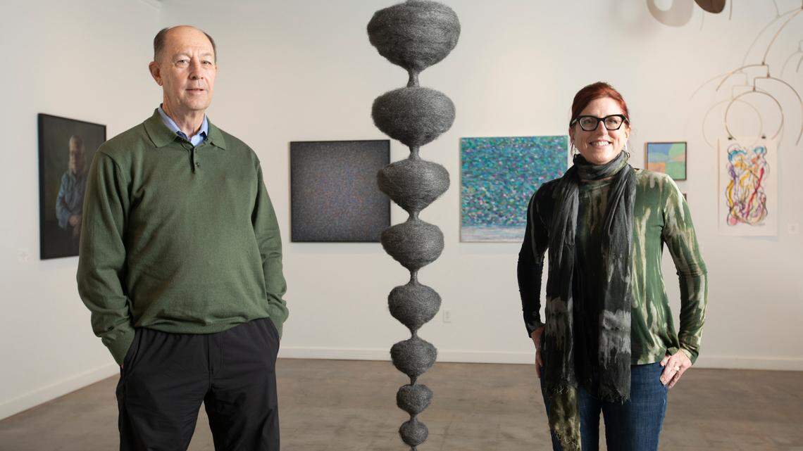 Mike Michaelis, left, is taking over the Reuben Saunders Gallery on Jan. 1. Trish VanOsdel, a practicing artist, will run the gallery. The sculpture in the center is hers. (December 9, 2020)