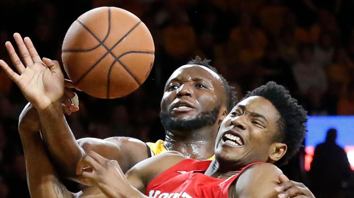 Wichita State center Morris Udeze fits for a ball with Houston center Brison Gresham (55) during first half action Saturday in Koch Arena.(January 18, 2020)