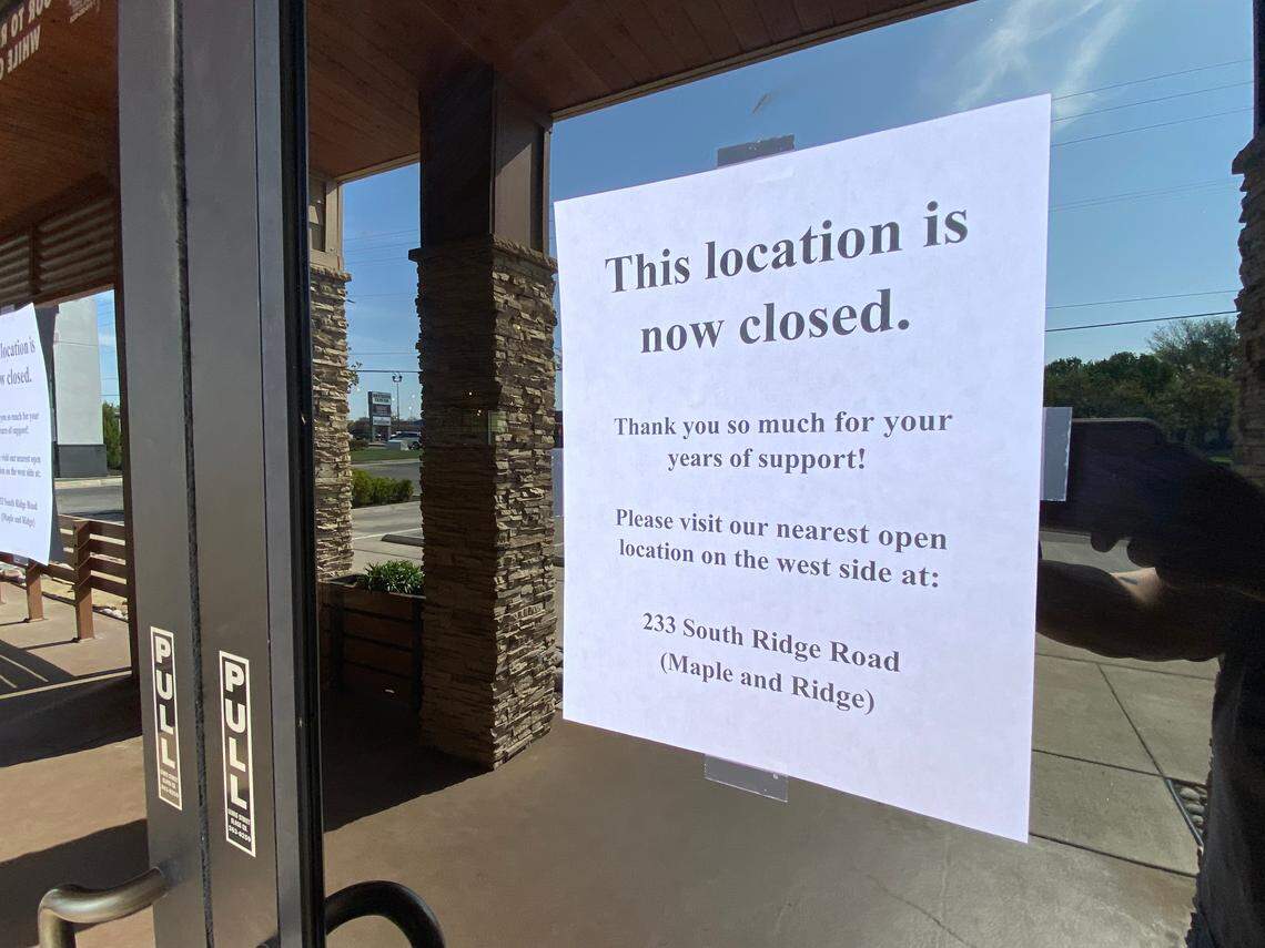 A sign on the door of the Outback Steakhouse at Bradley Fair announces that it is closed.