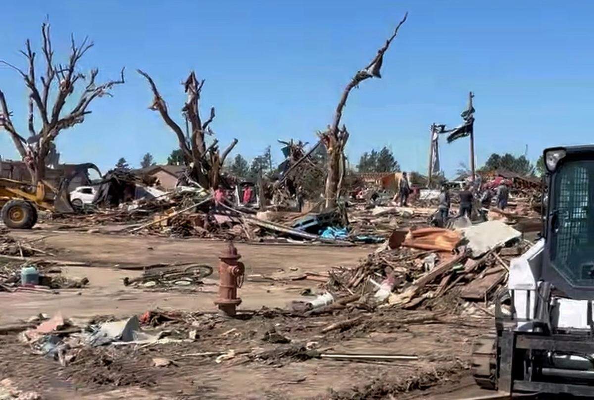 Gove County Sheriff Shawn Mesch described the town of Grinnell as devastated after a tornado hit Sunday night. Mesch pointed out trees being de-leafed, power lines snapped off and only a few homes left standing.