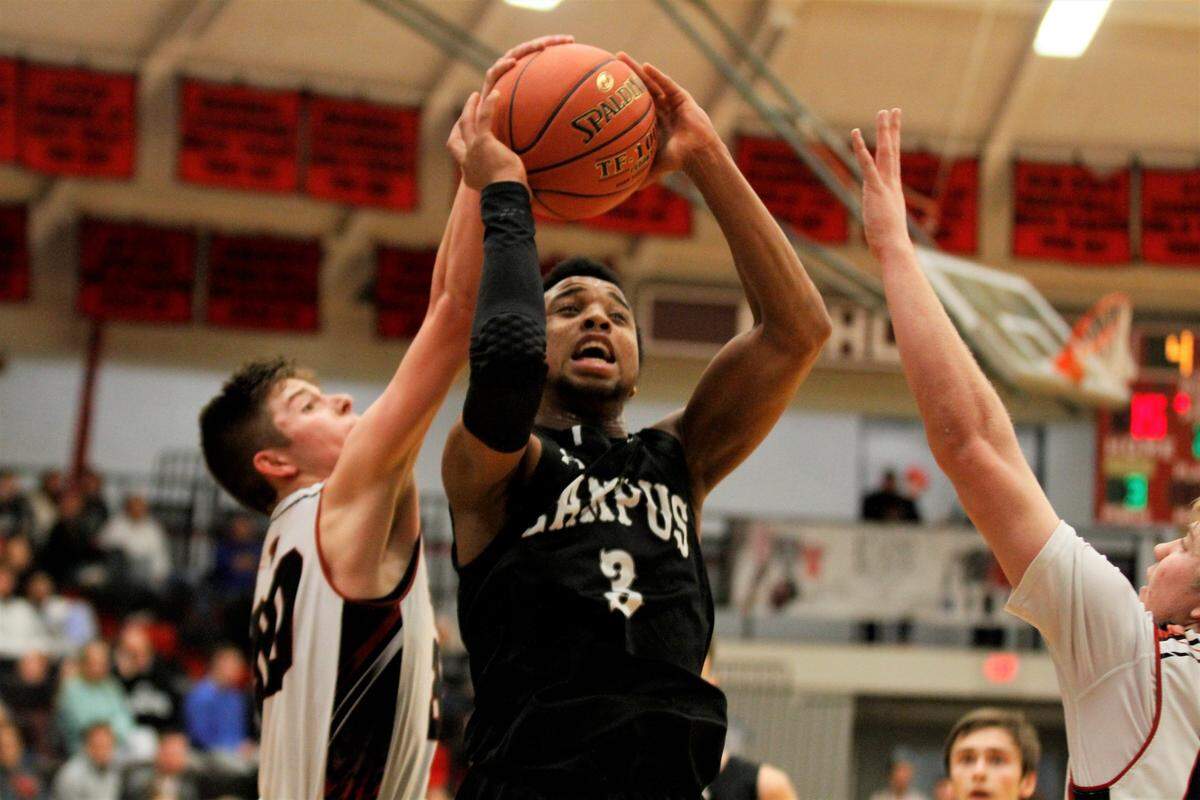 Campus sophomore Sterling Chapman gets blocked during the Colts’ 62-36 win over El Dorado in the Bluestem Classic semifinals Friday. (Jan. 18, 2019)