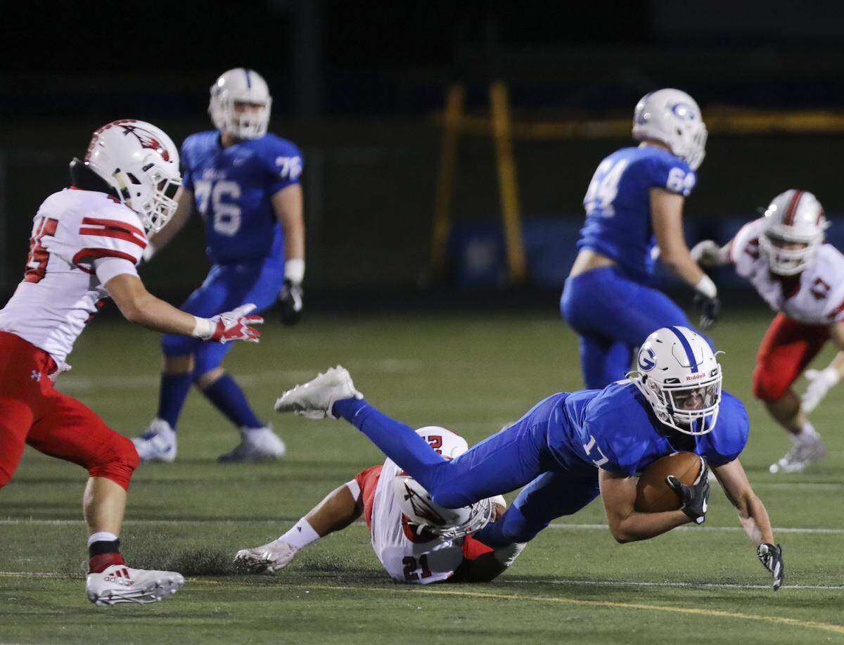 Goddard sophomore Jake Shope is brought down by Maize senior Jose Ledesma jr. during second quarter at Goddard High School. (Sept. 28, 2018)