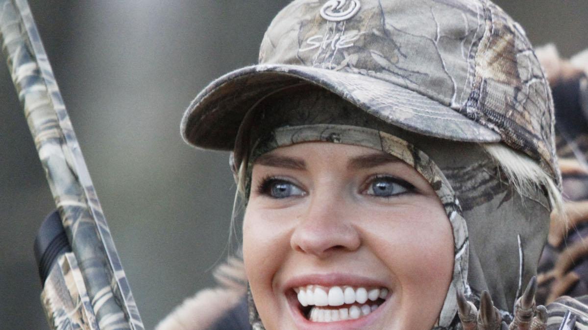 Theresa Vail, Miss Kansas, smiles after shooting her first turkey Friday morning. An avid hunter, she's agreed to host a television series for the Outdoor Channel. Vail filmed her first episode while at the Governor's Turkey Hunt in El Dorado.