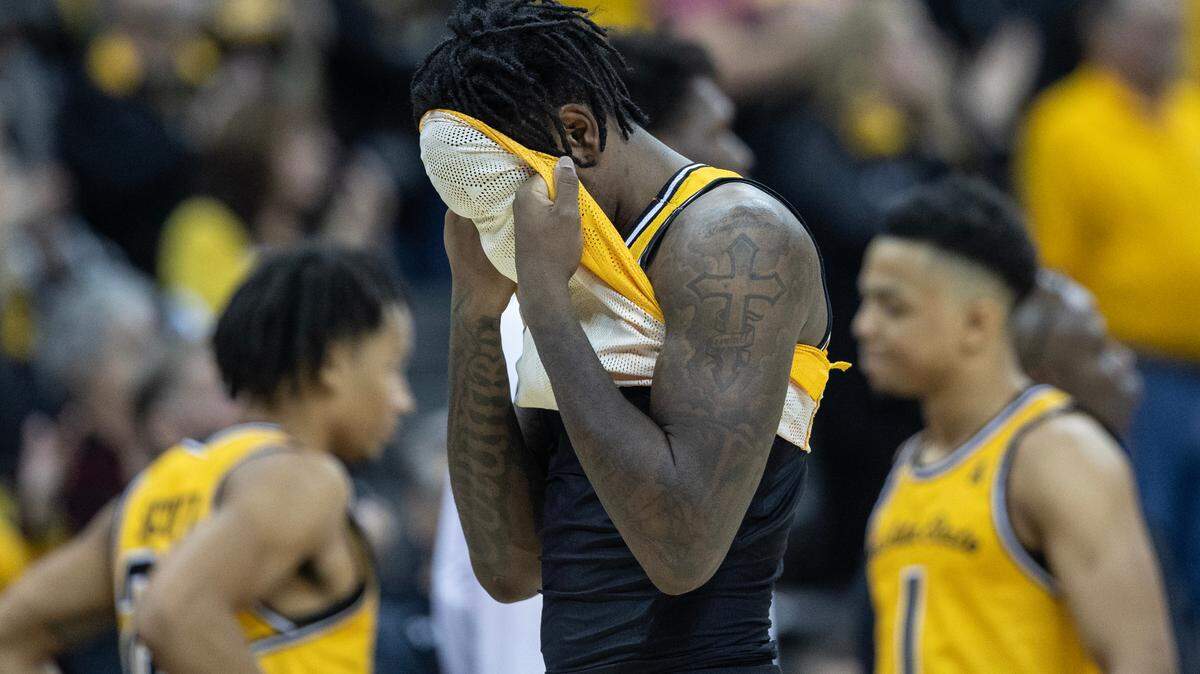 Wichita State’s Jaykwon Walton hides his face after the Shockers lost to San Francisco in the final of the Hall of Fame Classic in Kansas City on Tuesday. Walton had 21 points, but committed a crucial turnover late in the game.