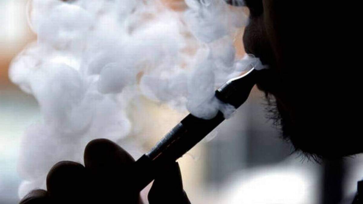 A man using an e-cigarette device.
