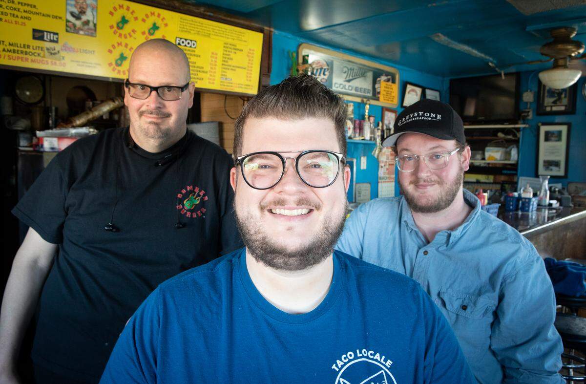 Jason Rickard, center, and his brother Jordan Rickard, right, are two chefs on the rise in Wichita. Their cousin is well-known Bomber Burger owner Chris Rickard, left.