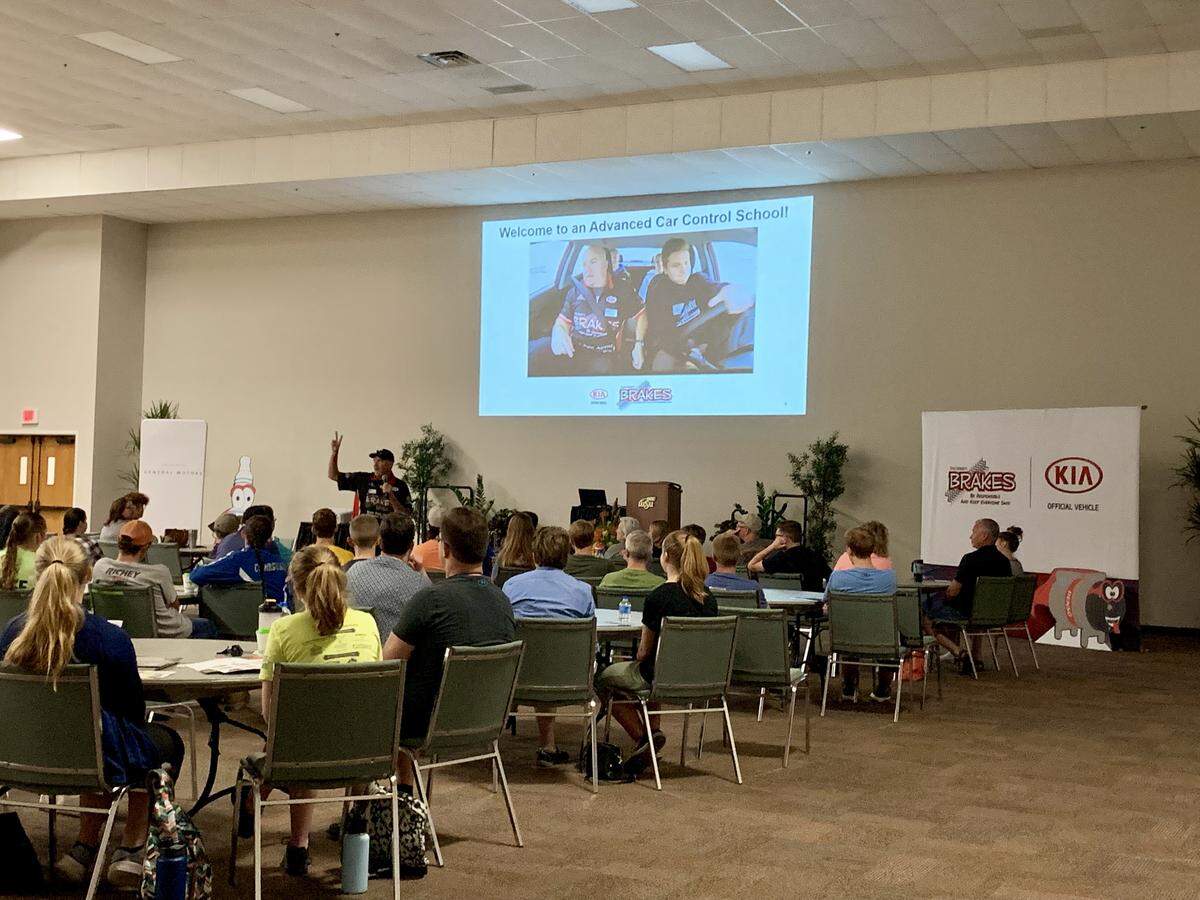 Brakes instructor leading the advanced car control presentation to parents and their teenagers, before beginning the hands-on training experience, July 27.