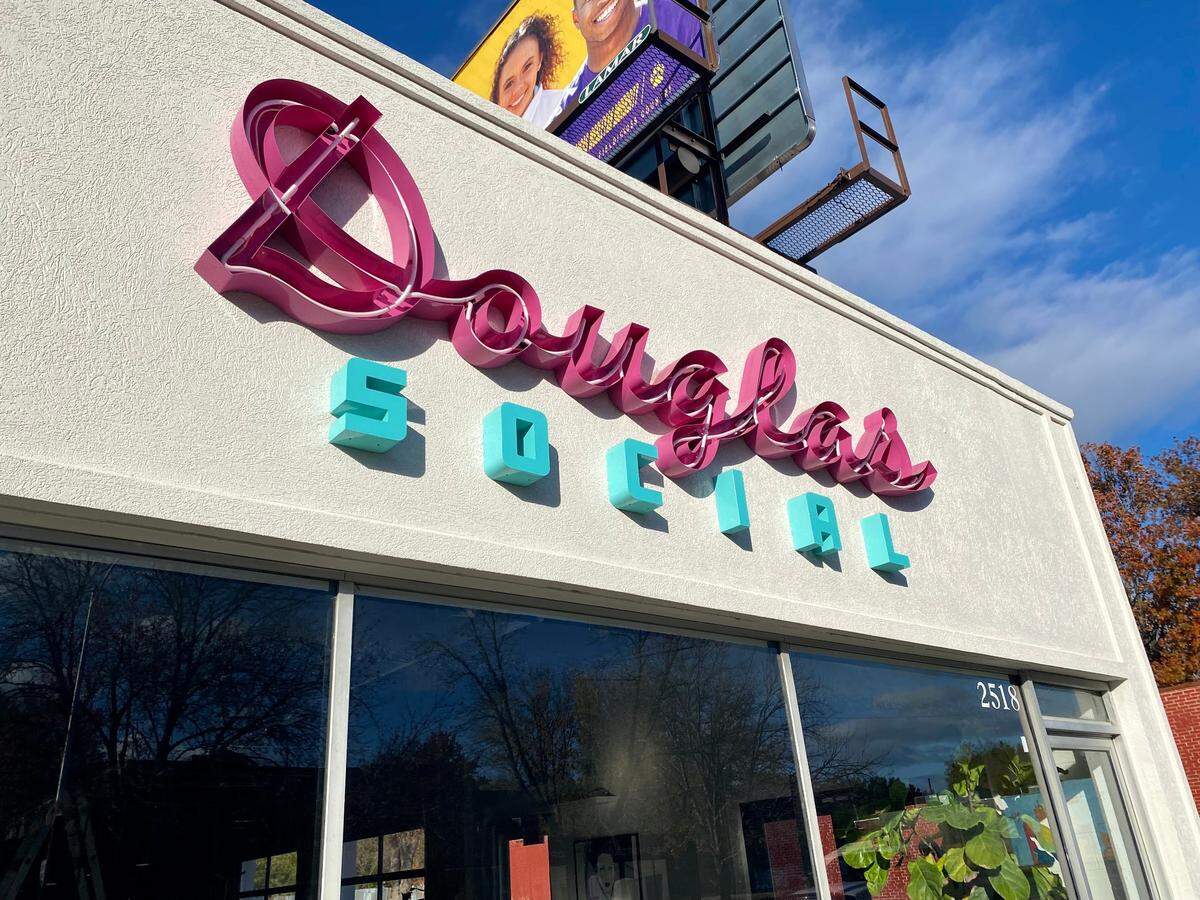 Travis Hatfield hung the colorful sign for his new bar Douglas Social in June, and people have been curious about it ever since.