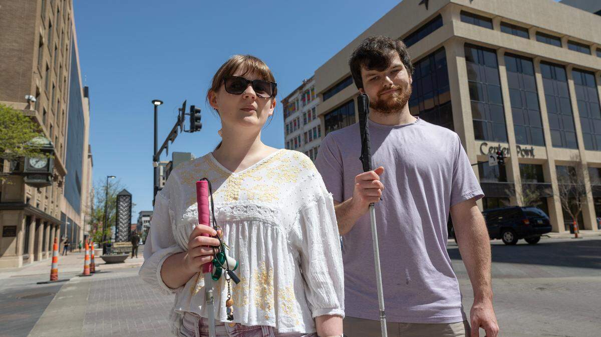 Alison Roets and Charlie Wilks are both visually impaired and both say downtown construction, along with new crosswalk buttons that don’t give audio signals, has made navigating downtown more difficult.