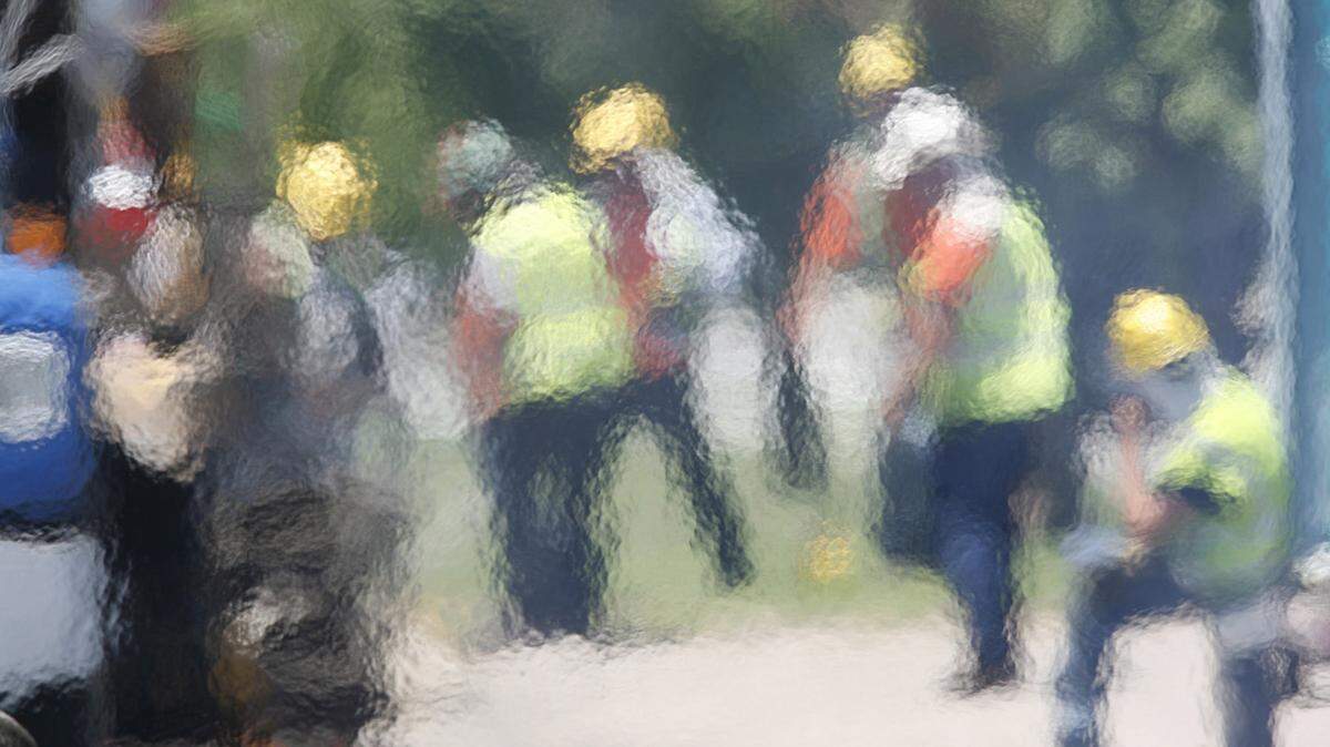 Heat waves paint a surreal image of employees with Cutler Repaving in 2009. Thursday will be a dangerous day to work outside in southern Kansas because of a heat index that could climb near 108 in spots.