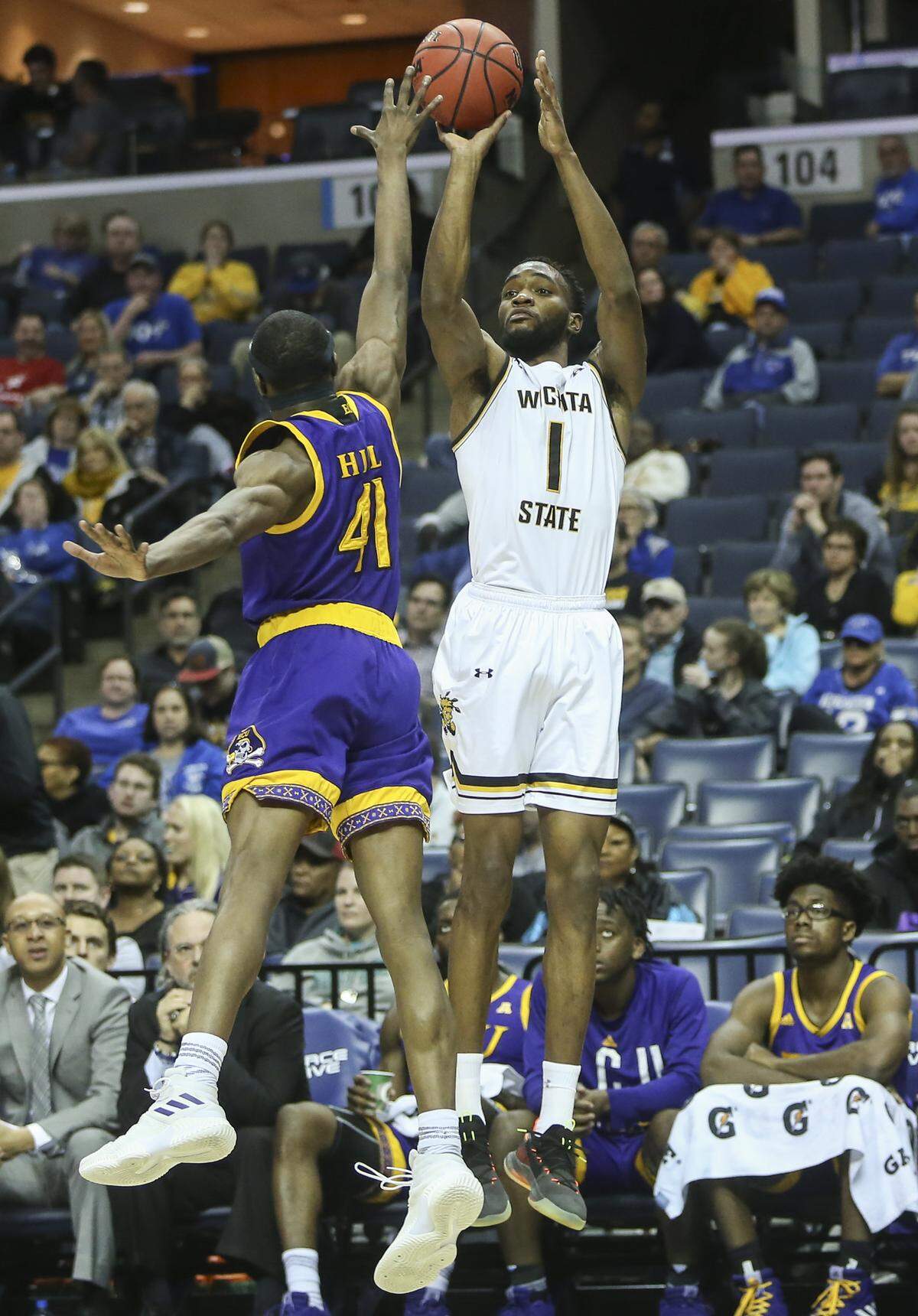Wichita State forward Markis McDuffie shoots over East Carolina guard Addison Hill during the first half of their game in Memphis on Thursday.