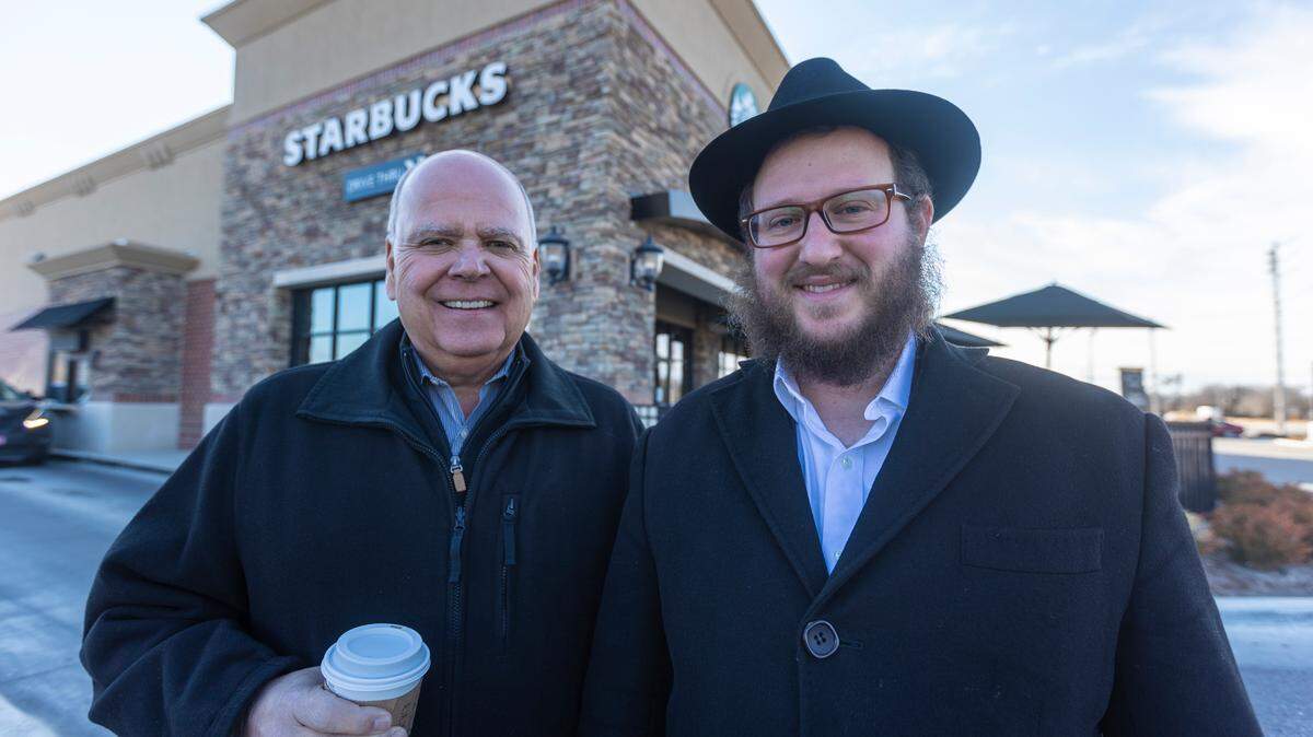 John McKenzie, left, was at the Starbucks at 21st and Greenwich last summer when he met Rabbi Shmulik Greenberg. McKenzie, who is president and CEO of Coldwell Banker Plaza Real Estate, helped Greenberg find new space for his Chabad of Wichita and Rural Kansas.