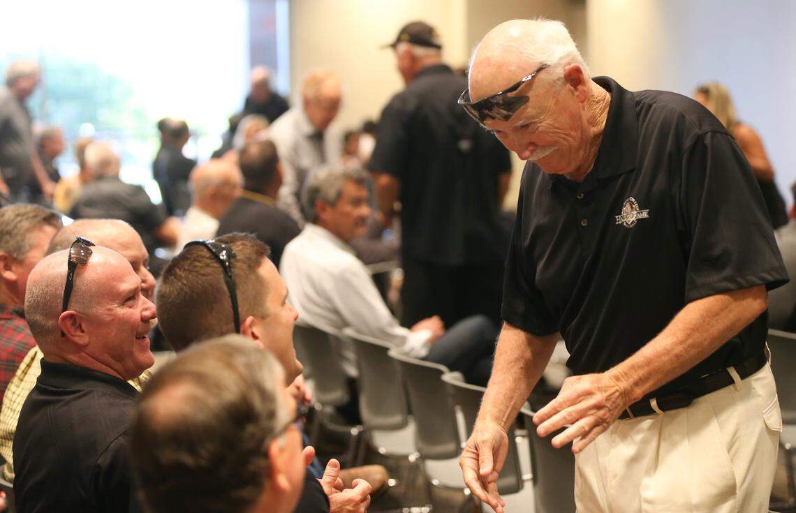 Former Wichita State University baseball coach Gene Stephenson speaks to former players before Eric Wedgemade his first appearance as the new WSU baseball coach.