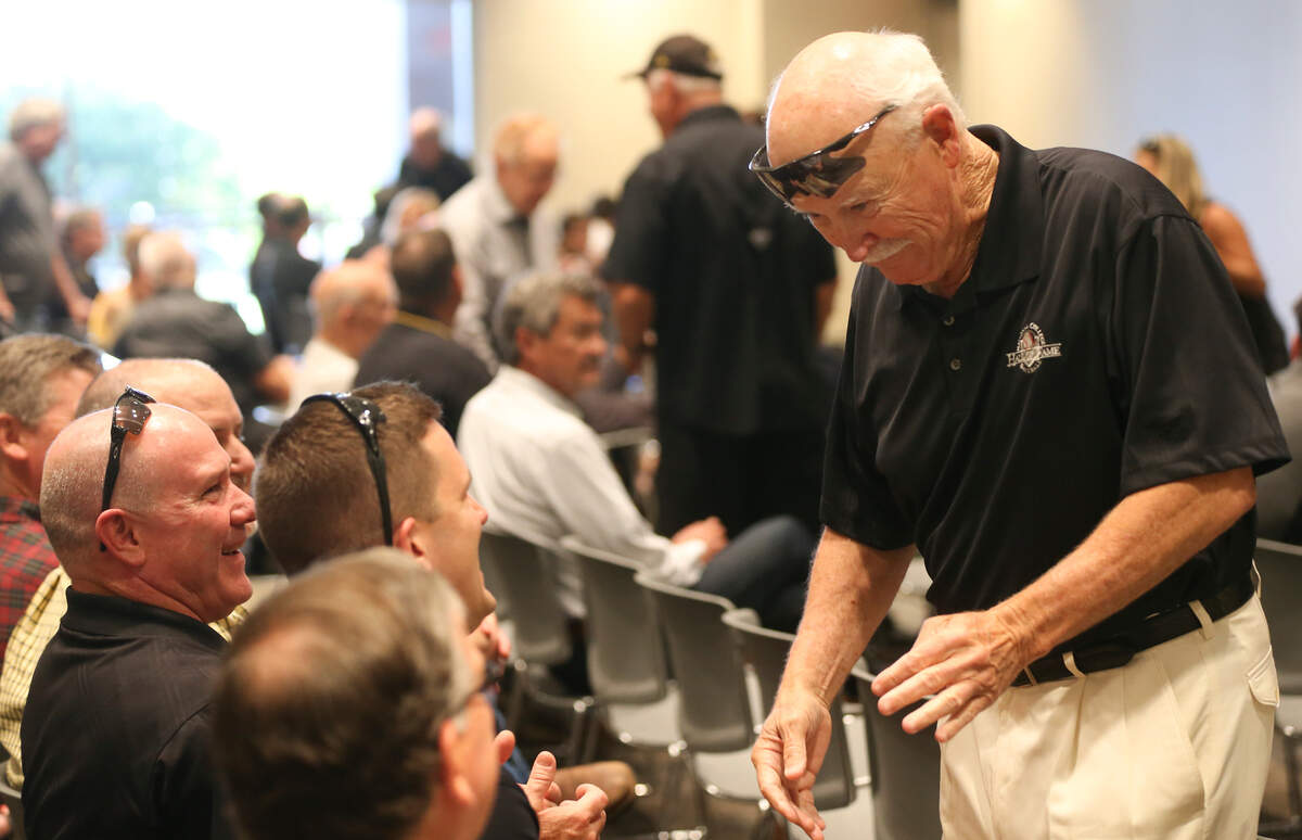 Former Wichita State University baseball coach Gene Stephenson speaks to former players before Eric Wedgemade his first appearance as the new WSU baseball coach.