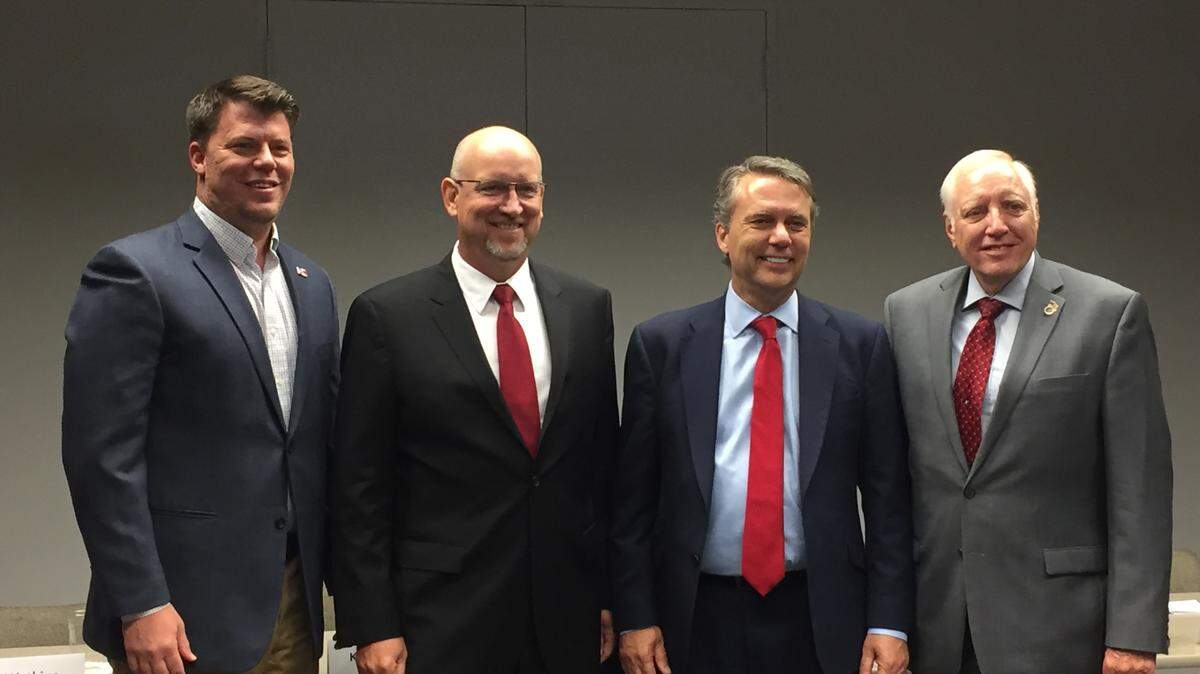 Wichita Chamber PAC Chairman Damon Young, Wichita Mayor Jeff Longwell, Kansas Gov. Jeff Colyer and Sedgwick County Commissioner David Dennis pose for a photo Monday at the Wichita Regional Chamber of Commerce.