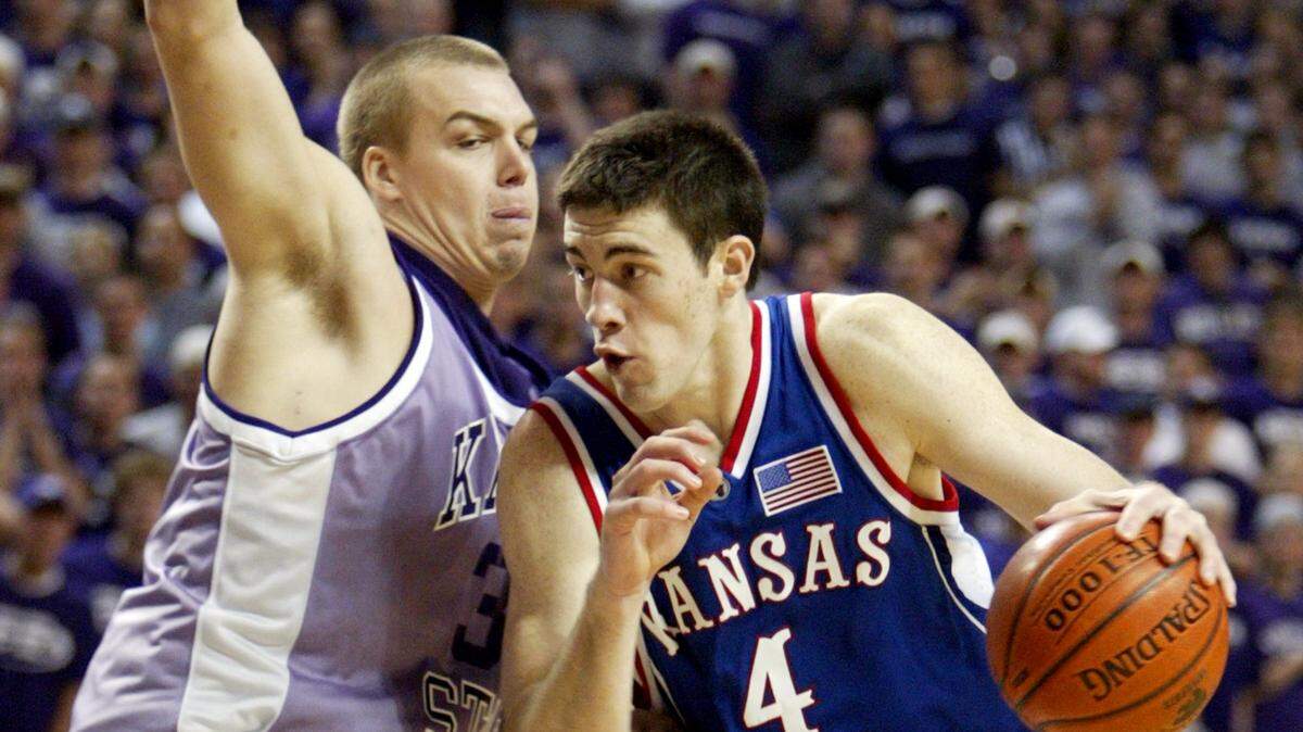 In this Eagle file photo, Kansas forward Nick Collison drives around Kansas State’s Matt Siebrandt in the second half of their game in Manhattan on Feb. 8, 2003. Collison was announced Thursday as part of the 2019 class for the Kansas Sports Hall of Fame.