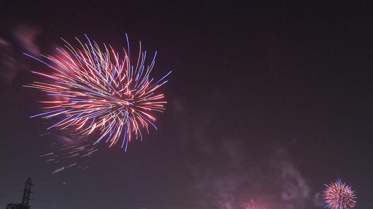 Fireworks explode near the Keeper of the Plains on the opening night of the Wichita River  Festival. (June 3, 2011)