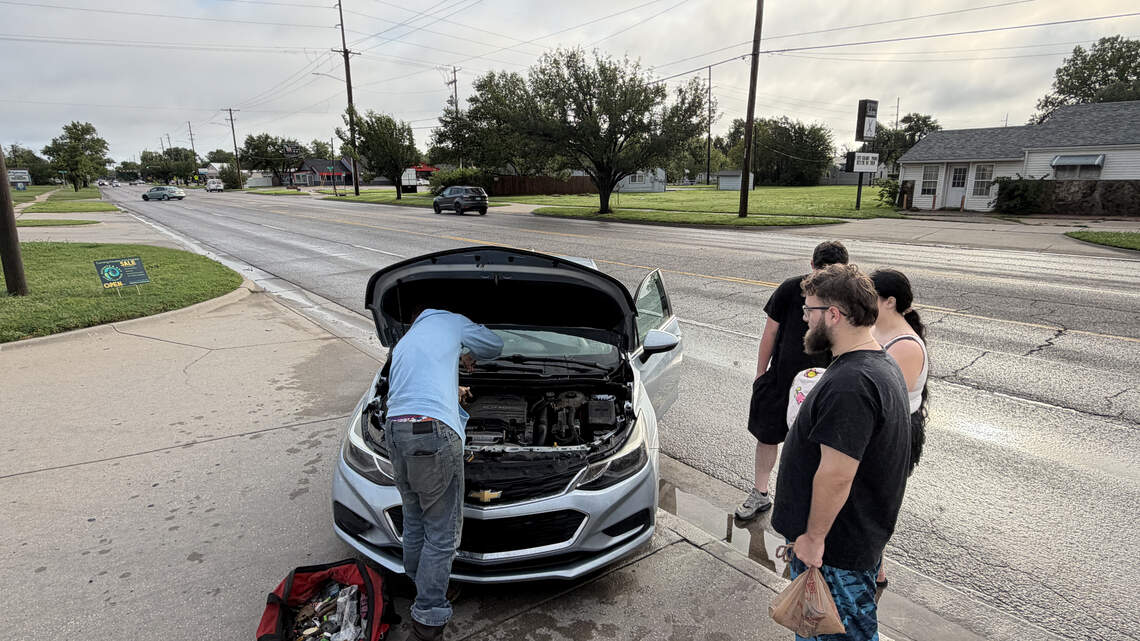 Torrential rain leaves some Wichita-area drivers stranded on flooded roadways