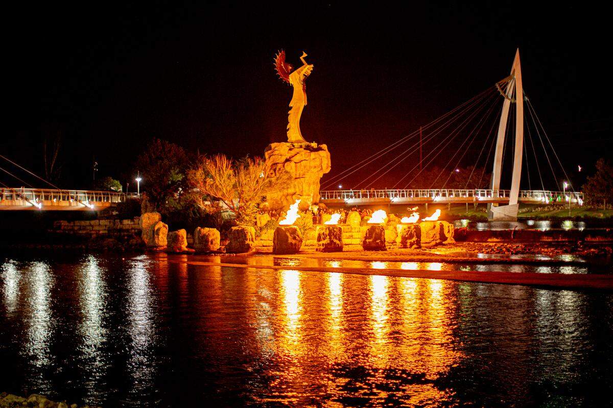 The Keeper of the Plains sculpture looks especially dramatic at night when its fire pots are lit.