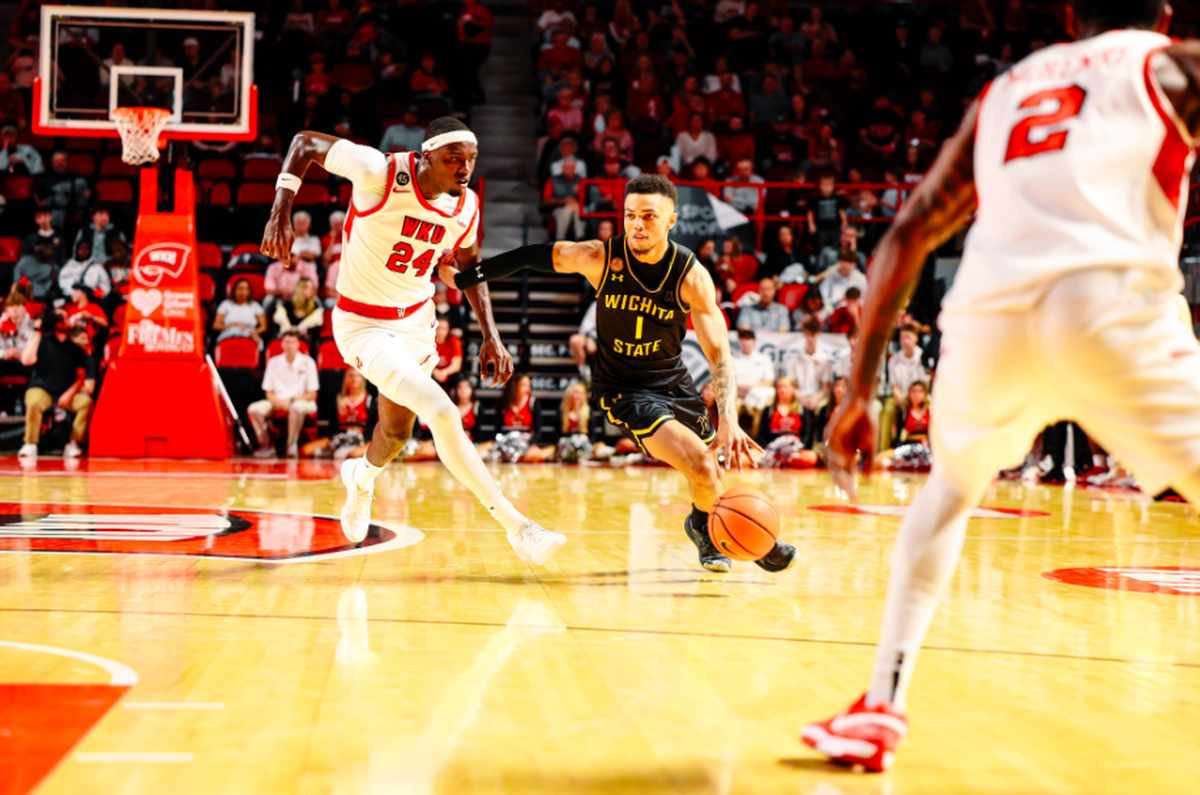 Wichita State guard Xavier Bell drives to the basket against Western Kentucky in Monday’s season-opening 91-84 win over the Hilltoppers at Diddle Arena.