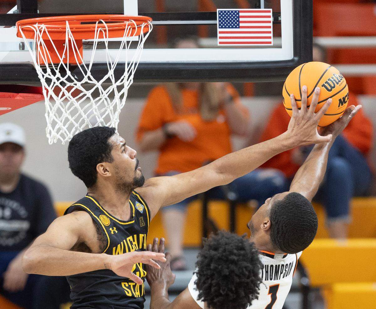 Wichita State’s Harlond Beverly blocks the shot of Oklahoma State’s Bryce Thompson during their first round NIT game in Stillwater, Ok., on Tuesday night.