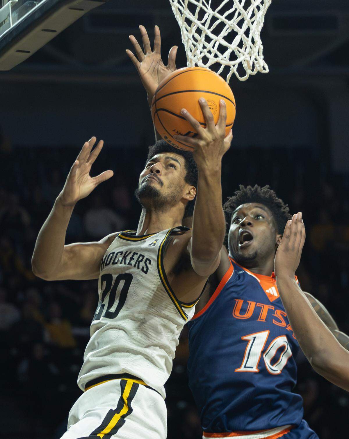 Wichita State’s Harond Beverly shoots a reverse layup against UTSA defender Chandler Cuthrell in the first half of Wednesday night’s game.