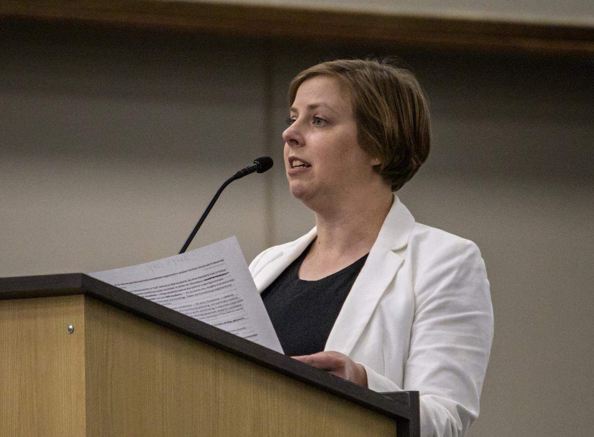 Amy Draut addresses the members of the Wichita Public Schools Board of Education on March 9 ahead of the board's vote to approve a timeline for the closure of four elementary schools. “The board has the authority and the obligation to press pause.," she said. "Vote no on this timeline, go back to the community, rebuild trust.”