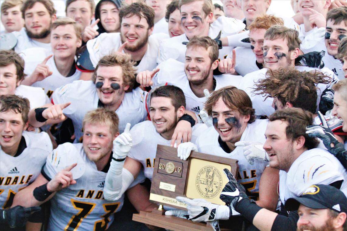 Andale poses with the 2019 Class 3A state championship trophy.