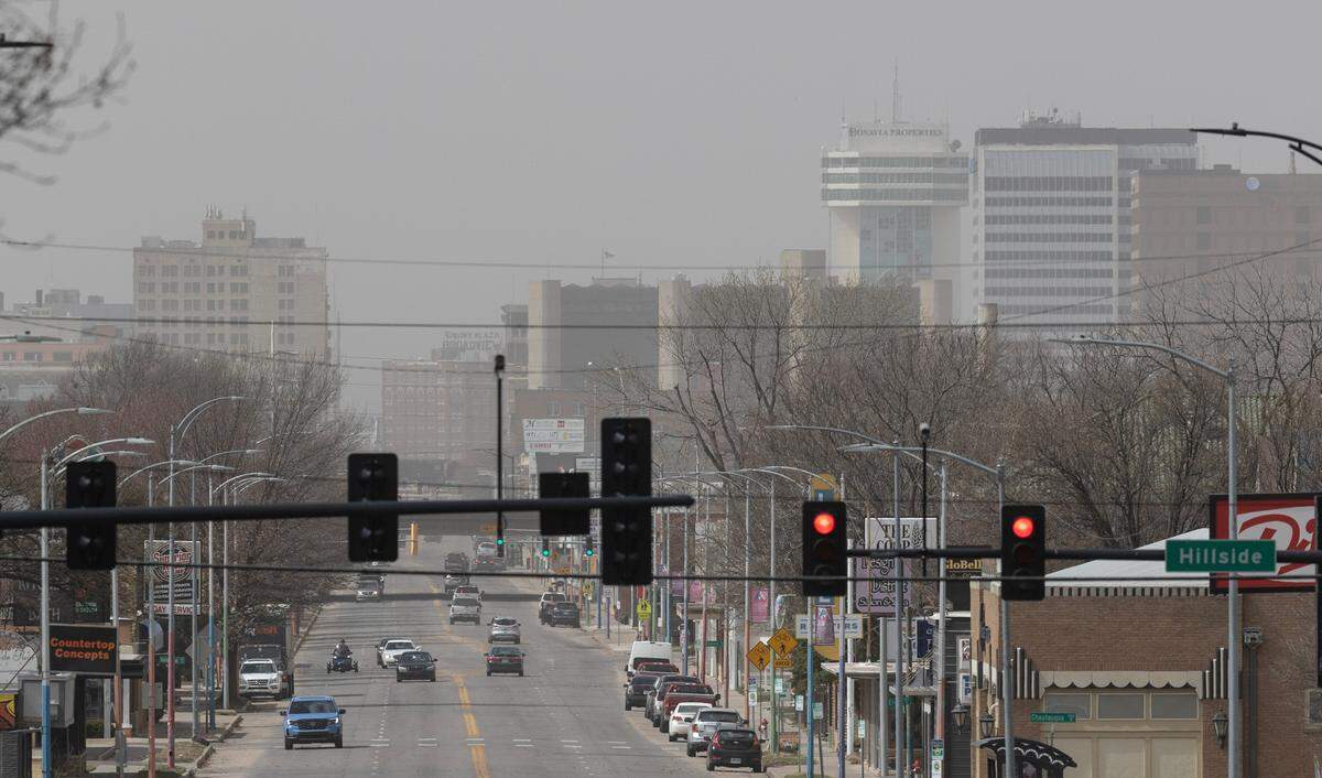 Heavy winds blew dust into Wichita on Friday, causing lowered visibility.