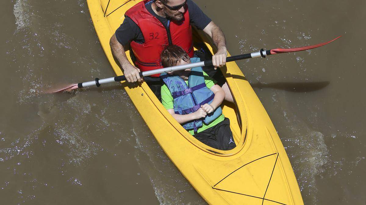 Kayakers make their way down the Arkansas River during the Wichita River Festival in 2018.