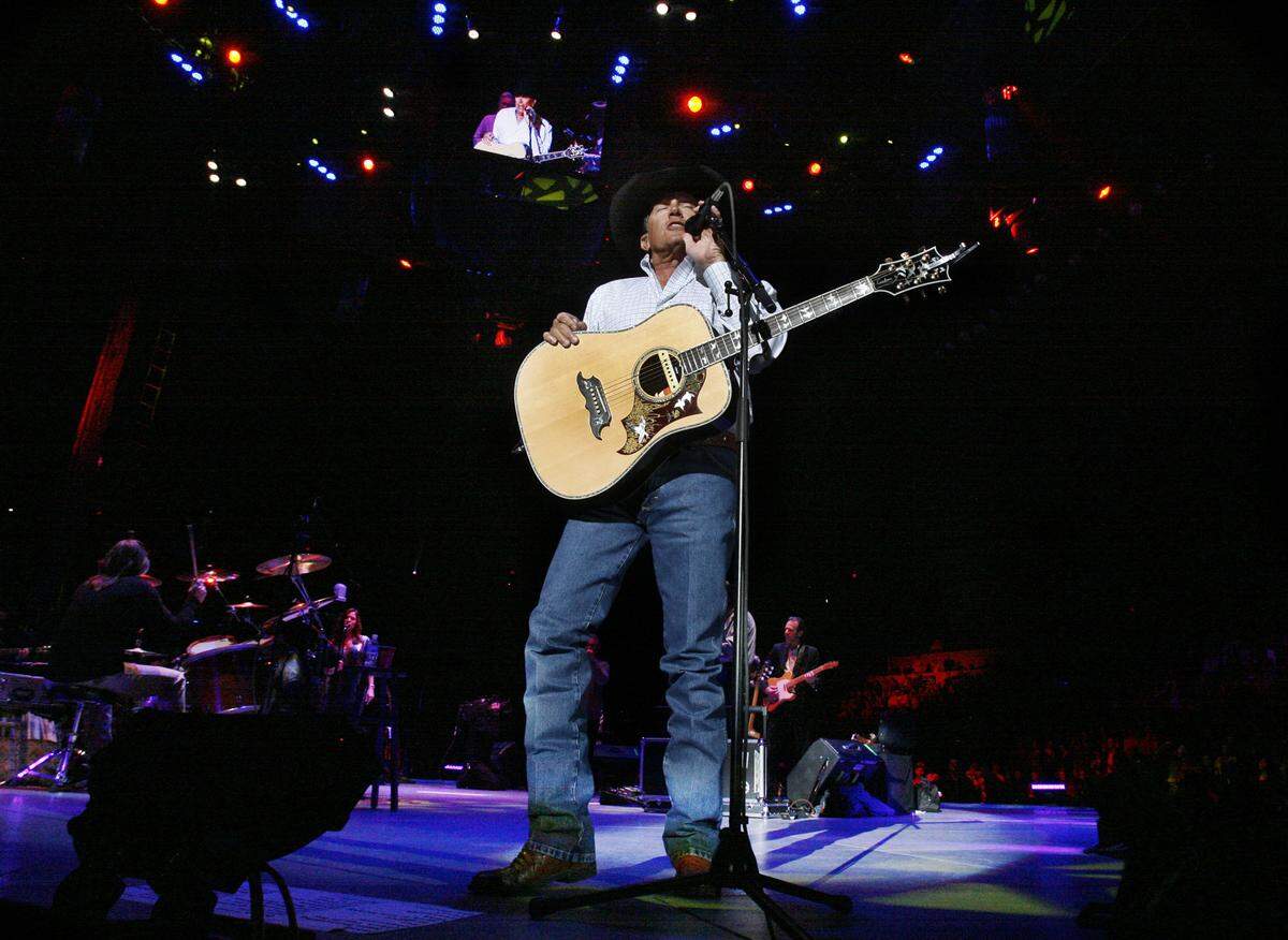Country star George Strait sings to the crowd at the Intrust bank Arena in February 2010.