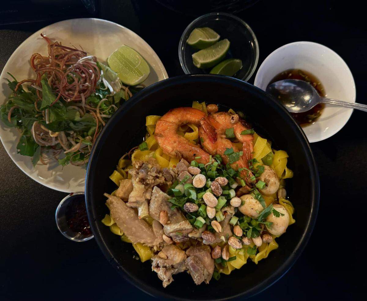 Among the dishes on the menu at the new Da Nang Bistro: Mi Quang, which is rice noodles infused with turmeric and served with pork, chicken, shrimp, quail eggs, peanuts, toasted sesame rice crackers and herbs.