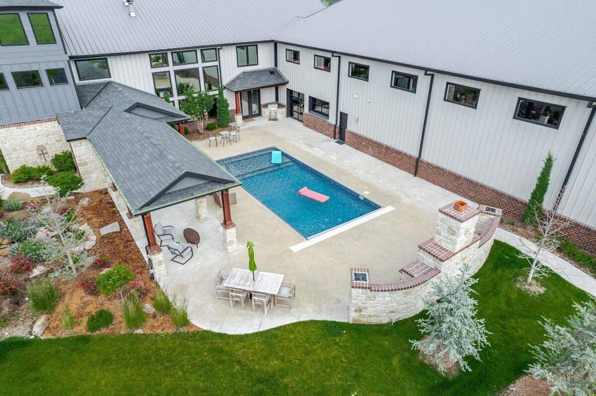 7053 S. 143rd St. E. in Derby has an outdoor pool and entertainment area.