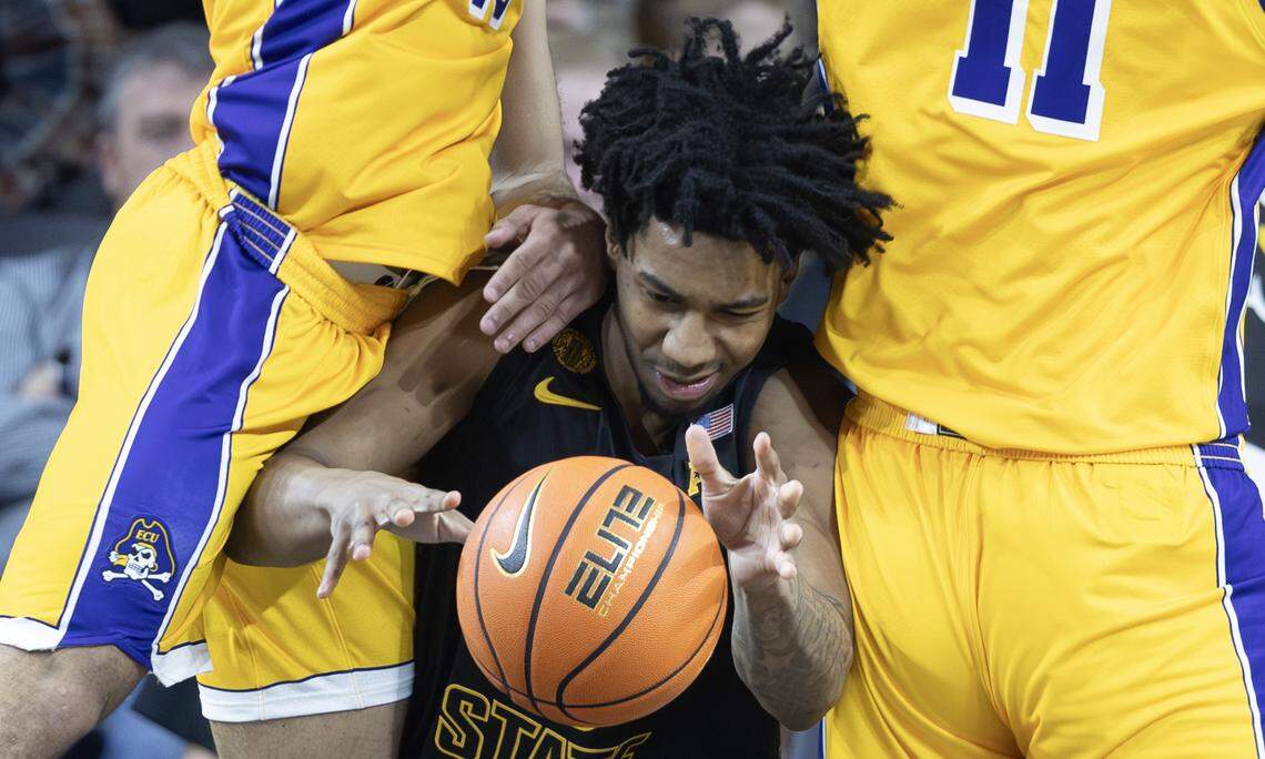 Wichita State’s Dillon Battie gets stuck between two East Carolina forwards during the second half on Wednesday night at Koch Arena.