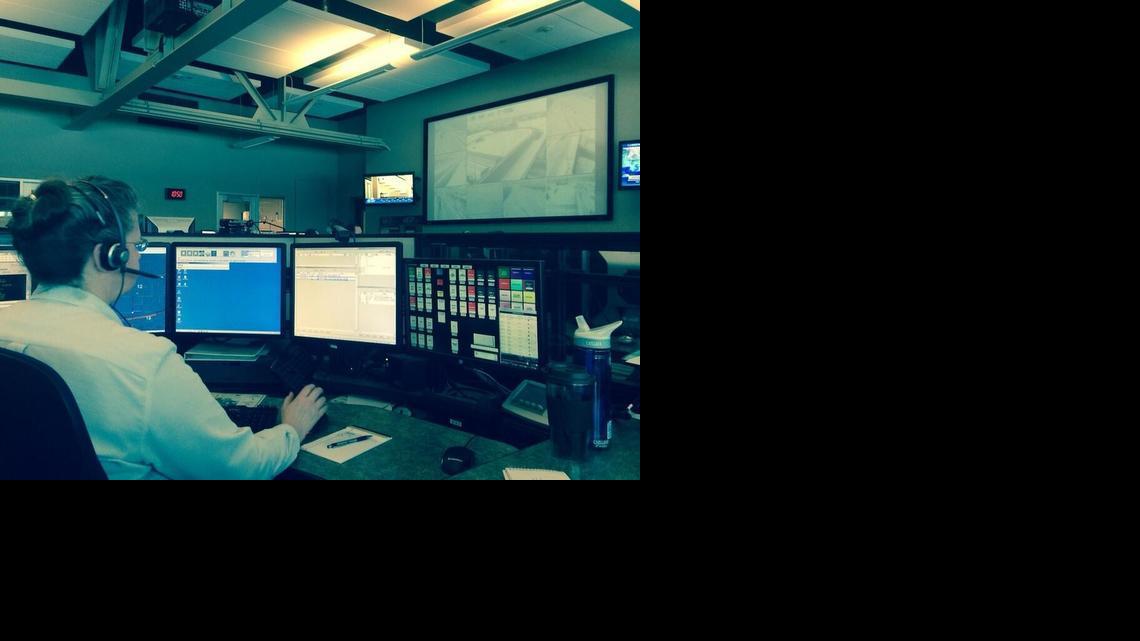 Sedgwick County 911 dispatcher Stephanie Ricker responds to calls on Tuesday, Feb. 4, 2014. Dispatchers worked 87 accident calls between 5 a.m. and 1 p.m. Tuesday. During the same timeframe Monday, they worked 32 accident calls.

