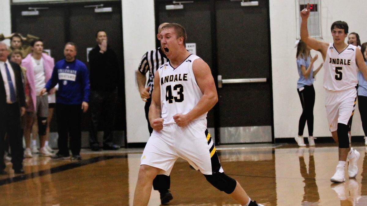 Andale’s Mason Fairchild celebrates after the Indians clinch a 56-55 overtime win against rival Collegiate on Friday night. (Dec. 14, 2018)